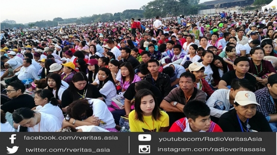 The faithful gather in the open air at Kyaikkasan grounds to wait for a Holy mass of Pope Francis