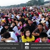 The faithful gather in the open air at Kyaikkasan grounds to wait for a Holy mass of Pope Francis